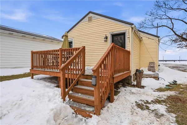 a view of a patio with dining table and chairs with a fire pit