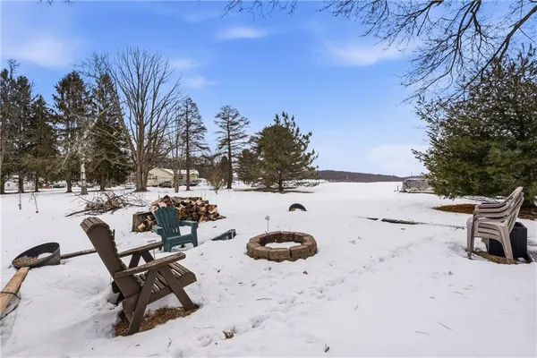 a view of snow with trees