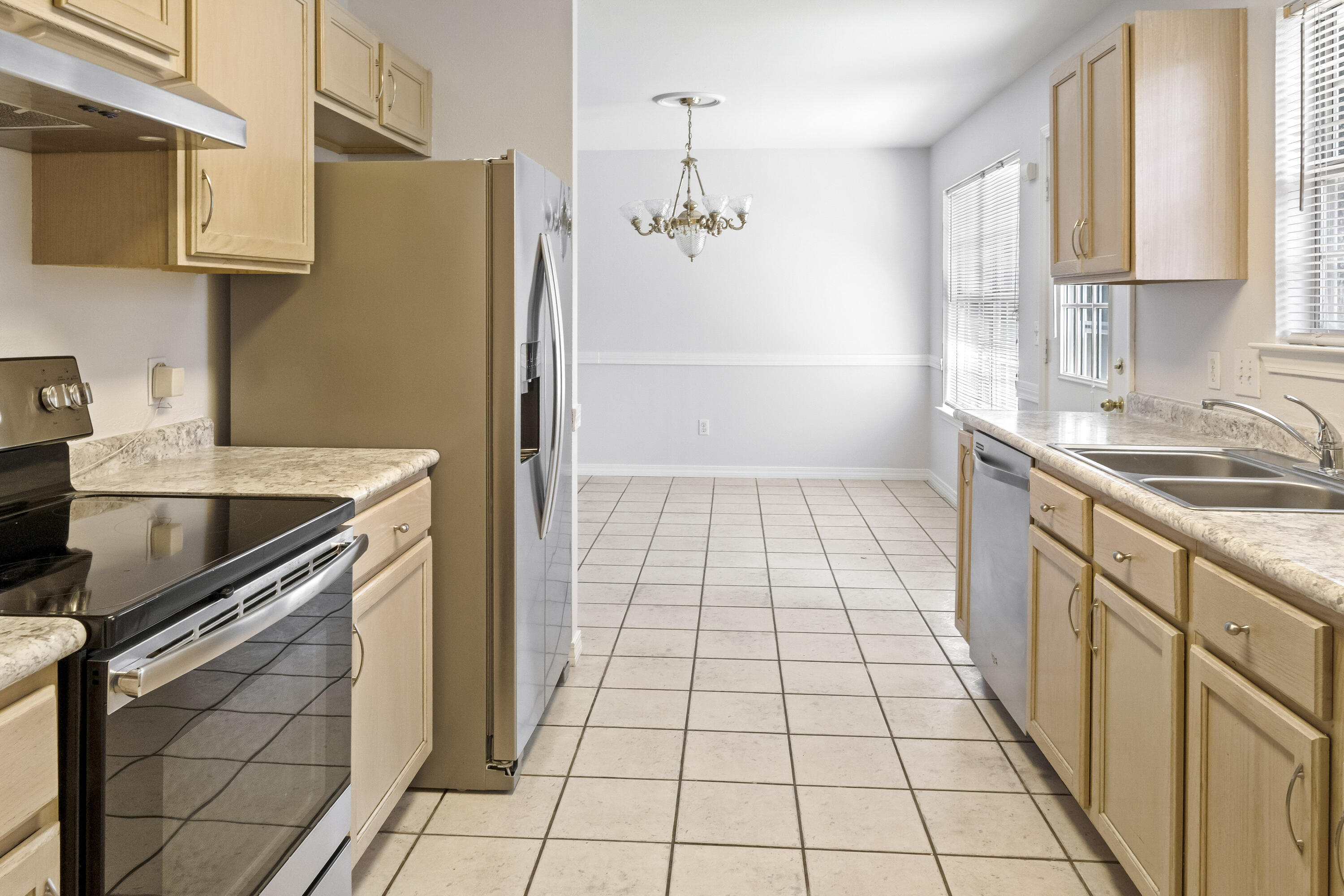 56 Kimberly Ann Drive Santa Rosa Beach, FL 32459 - Photo 11 of 39 a kitchen with a sink a stove and a refrigerator