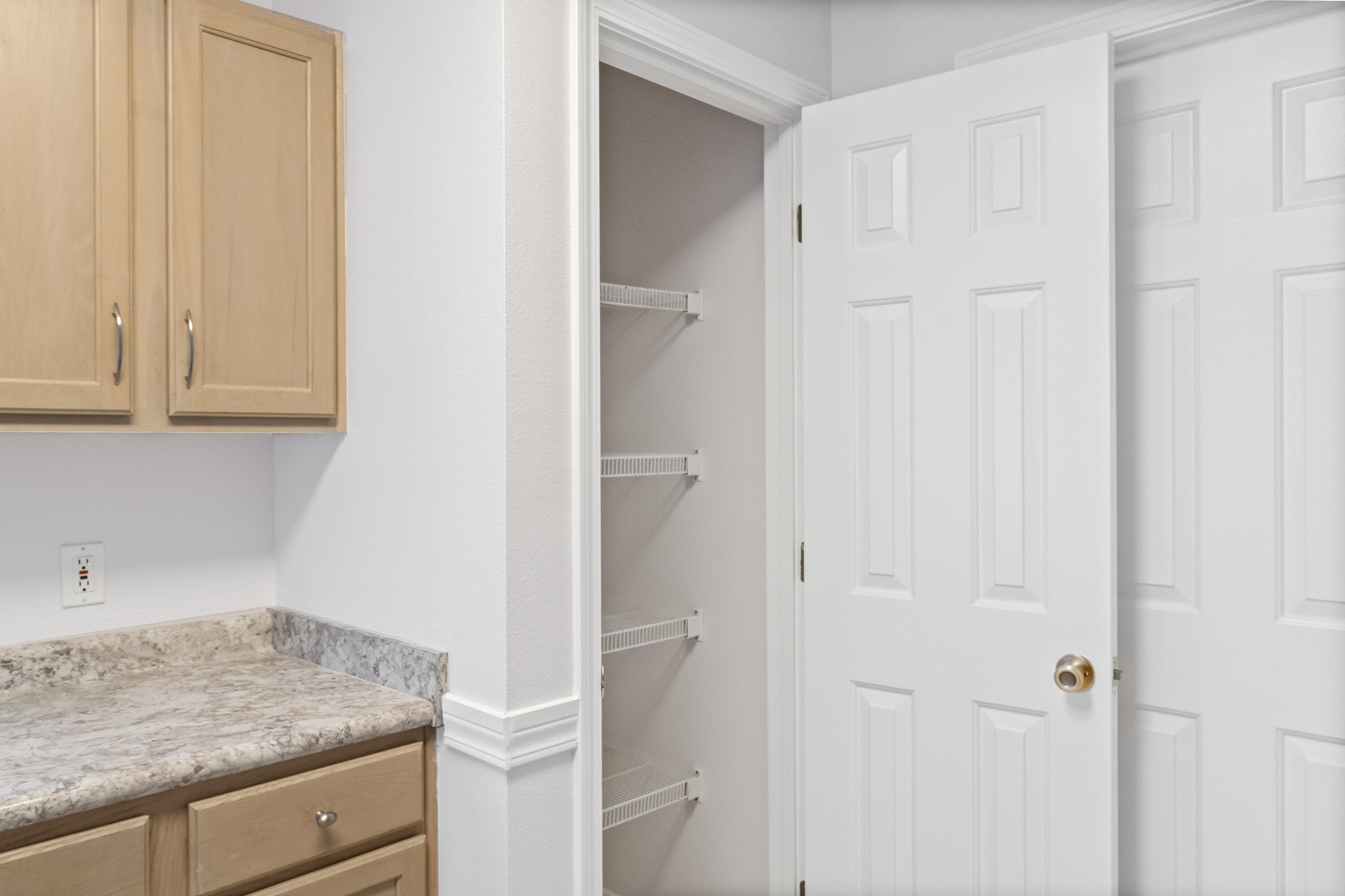 56 Kimberly Ann Drive Santa Rosa Beach, FL 32459 - Photo 12 of 39 a bathroom with a granite countertop sink and white cabinets