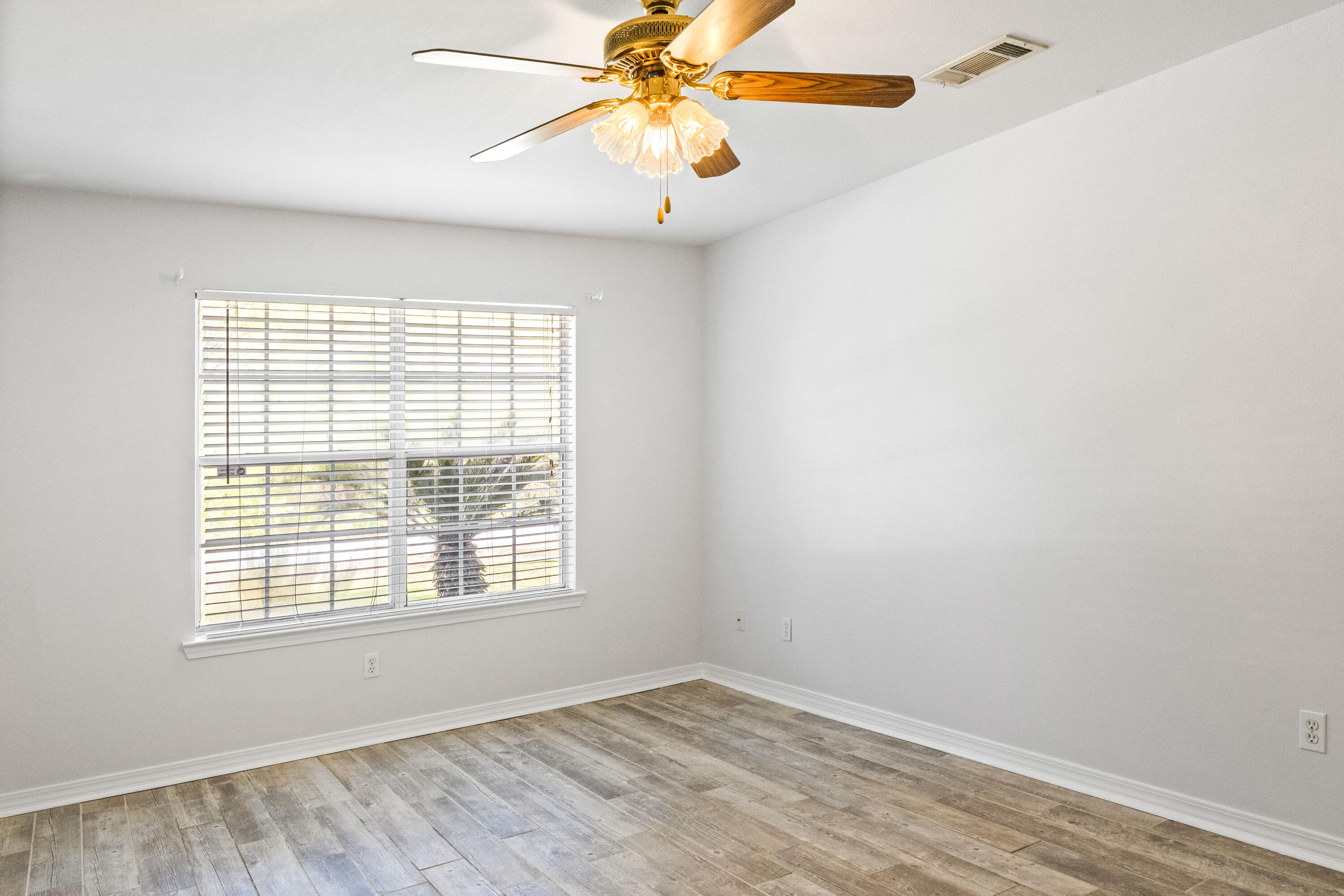 56 Kimberly Ann Drive Santa Rosa Beach, FL 32459 - Photo 17 of 39 wooden floor in an empty room with a window