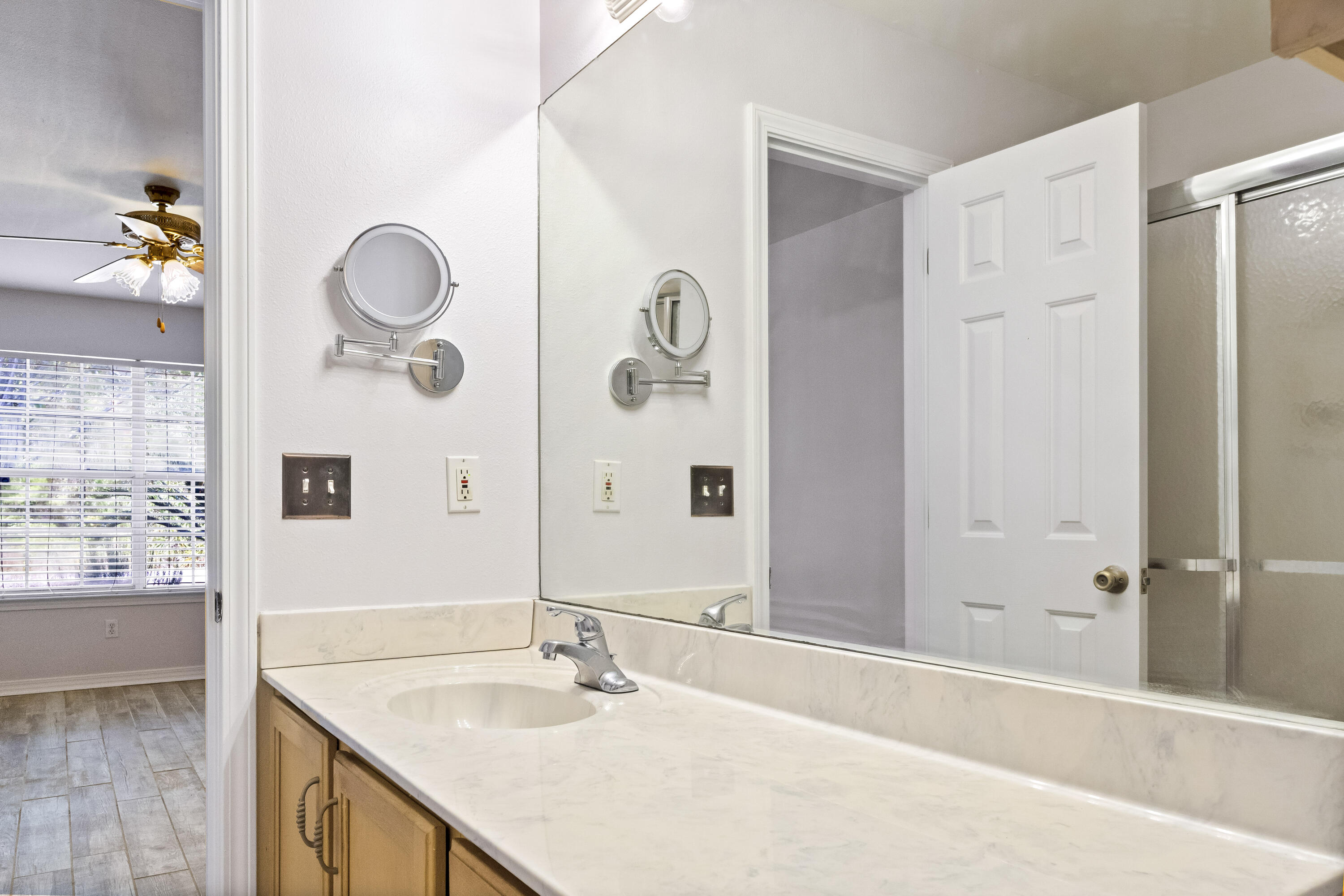56 Kimberly Ann Drive Santa Rosa Beach, FL 32459 - Photo 19 of 39 a bathroom with a granite countertop sink and a mirror