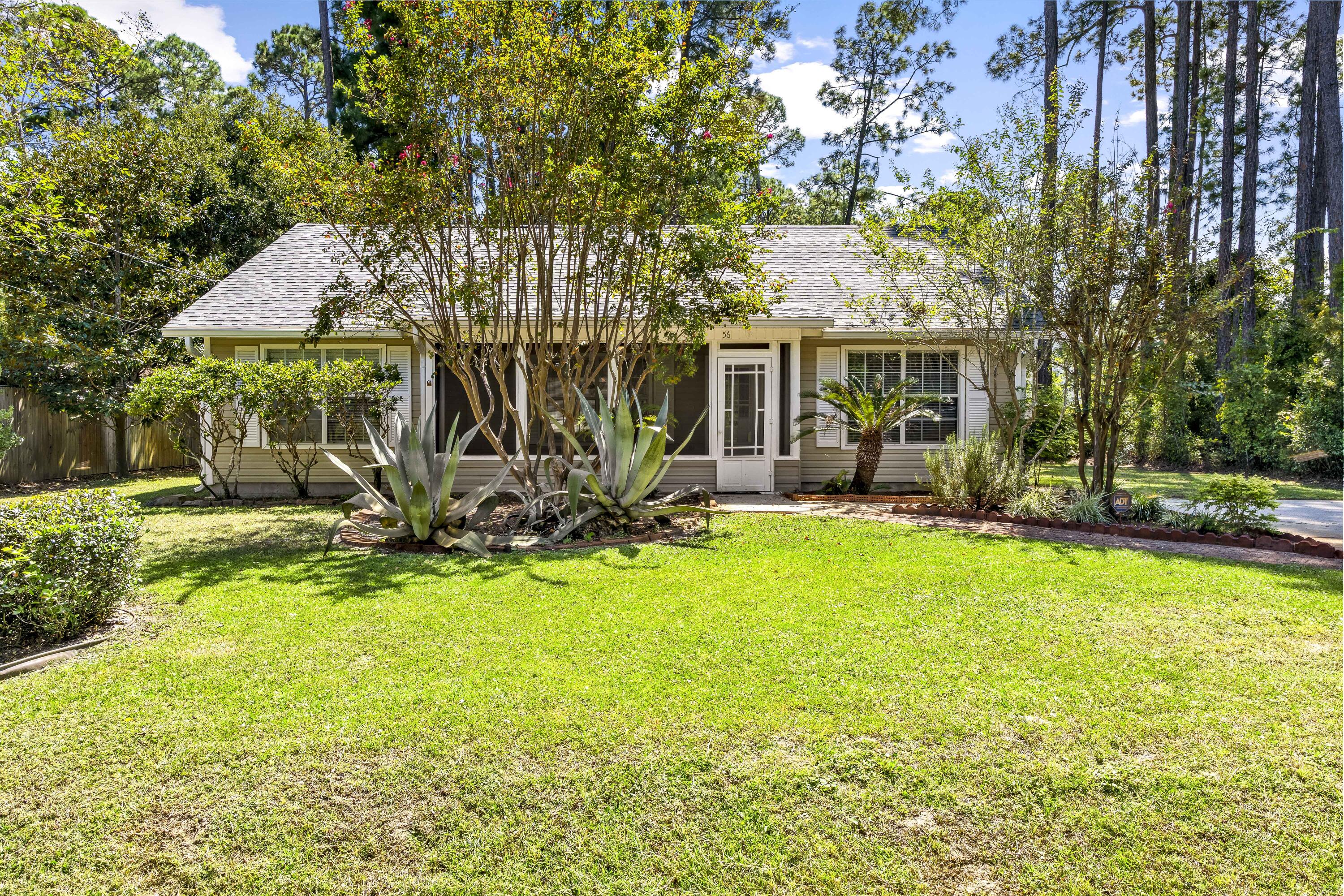 56 Kimberly Ann Drive Santa Rosa Beach, FL 32459 - Photo 2 of 39 a view of a house with backyard porch and sitting area