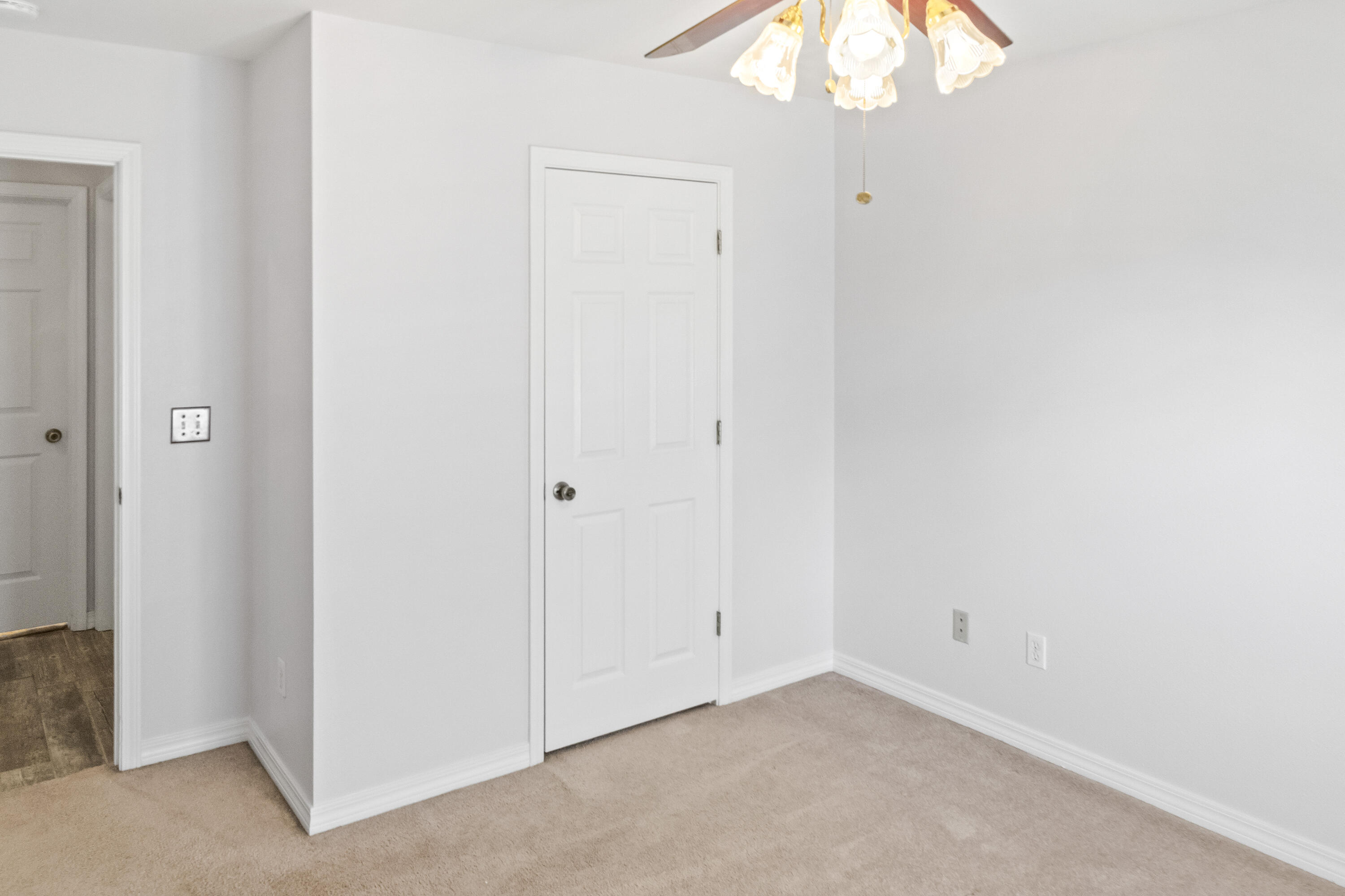 56 Kimberly Ann Drive Santa Rosa Beach, FL 32459 - Photo 25 of 39 an empty room with a chandelier fan