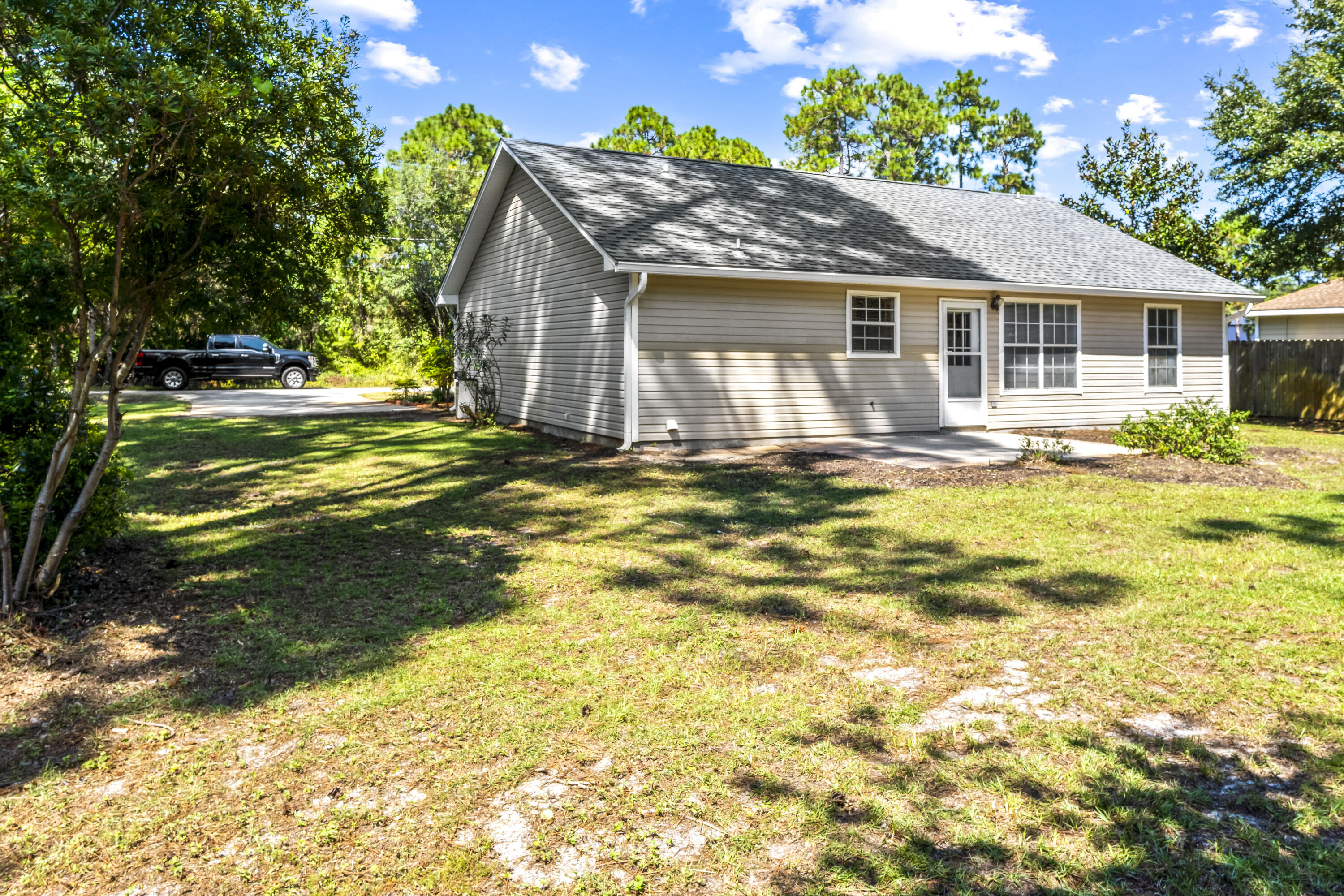 56 Kimberly Ann Drive Santa Rosa Beach, FL 32459 - Photo 35 of 39 a view of a house with a swimming pool