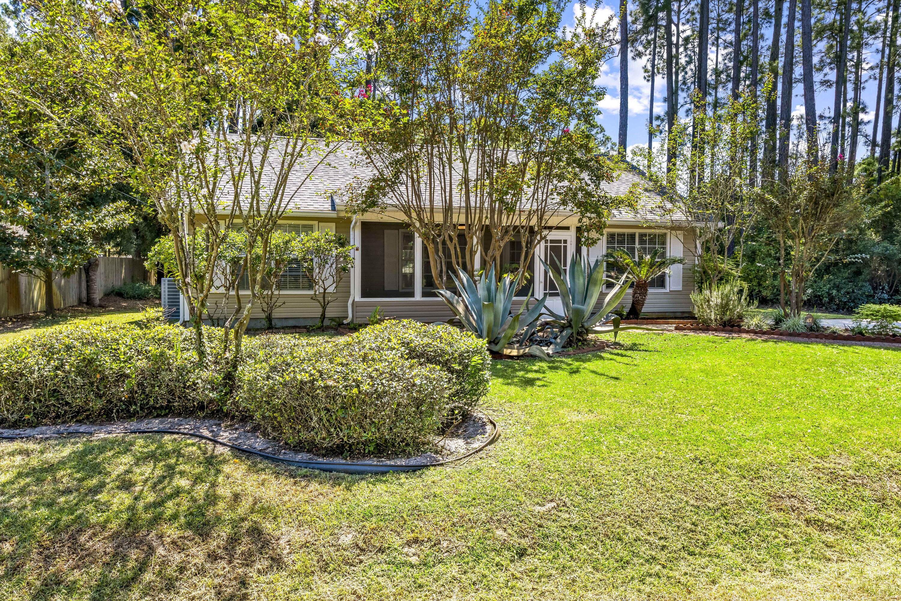 56 Kimberly Ann Drive Santa Rosa Beach, FL 32459 - Photo 36 of 39 a front view of a house with garden