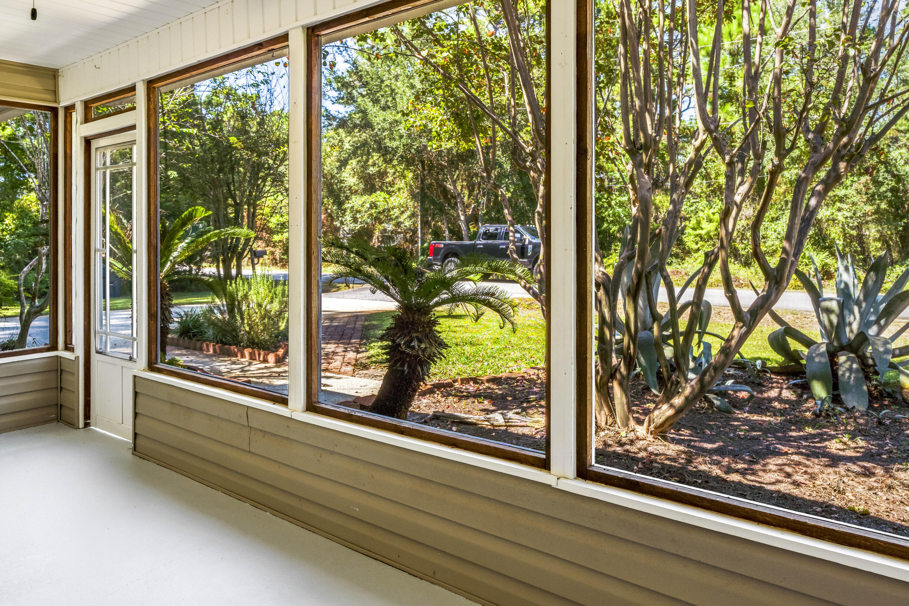 56 Kimberly Ann Drive Santa Rosa Beach, FL 32459 - Photo 4 of 39 a view of a room with a large window and wooden floor