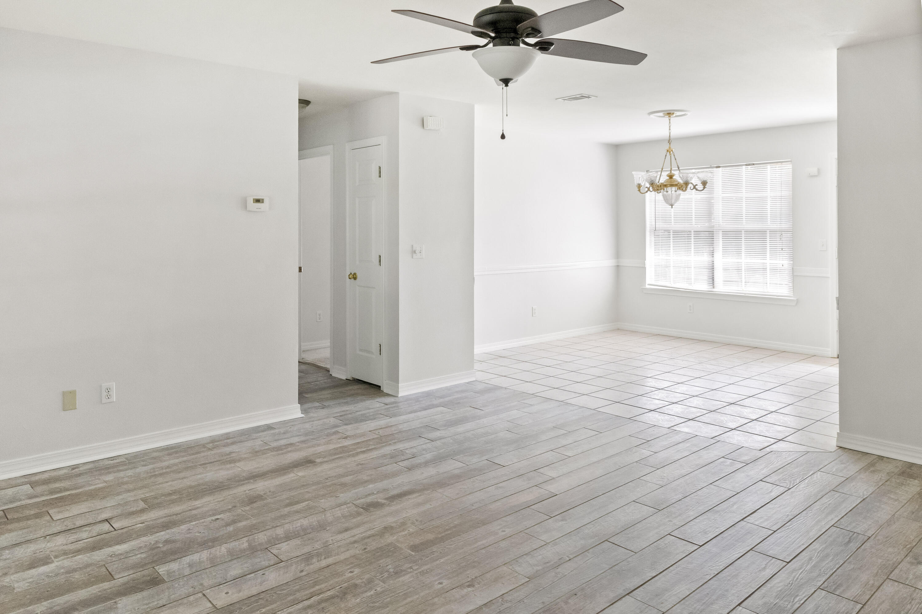 56 Kimberly Ann Drive Santa Rosa Beach, FL 32459 - Photo 7 of 39 wooden floor in an empty room with a window