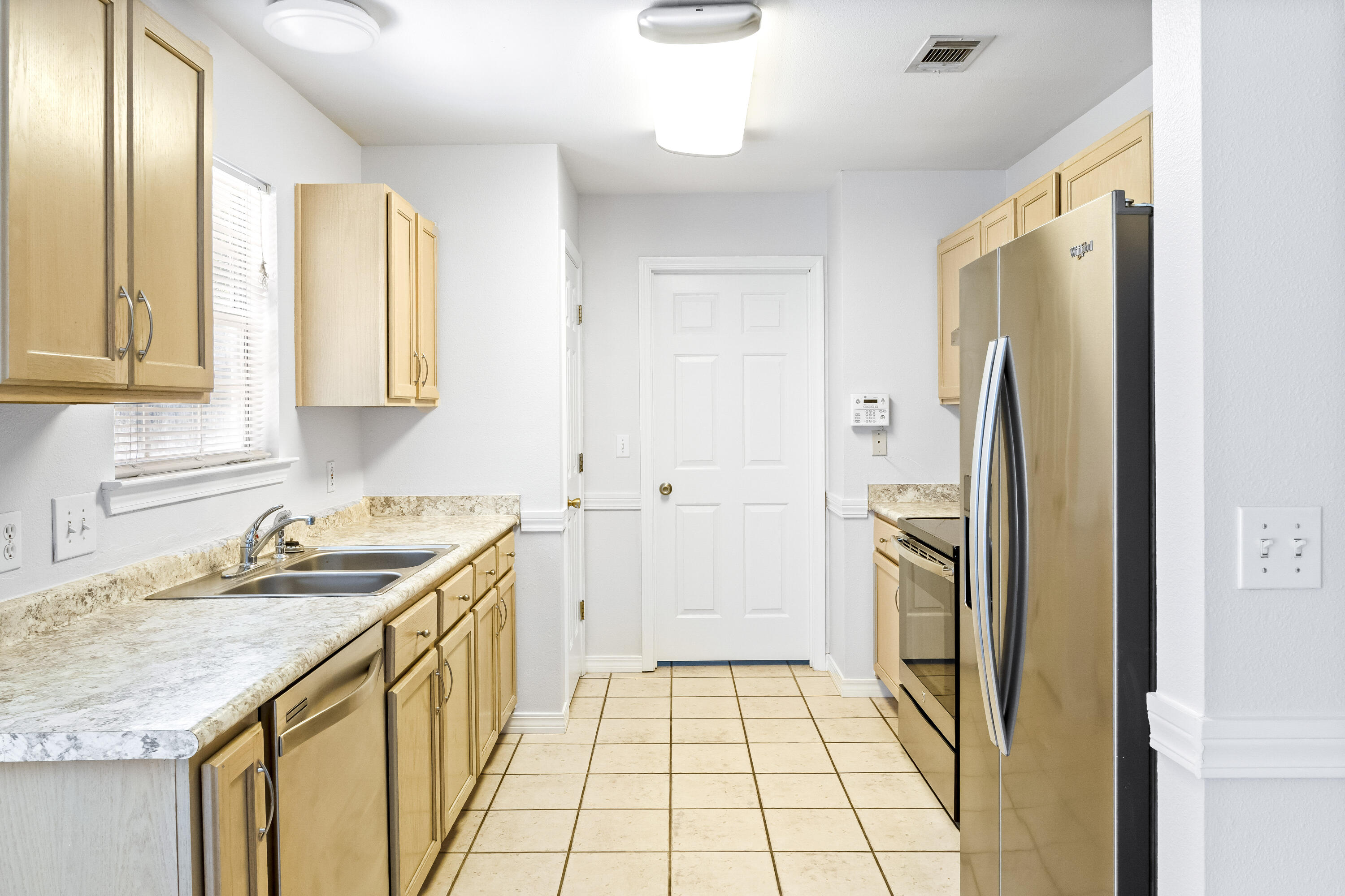56 Kimberly Ann Drive Santa Rosa Beach, FL 32459 - Photo 9 of 39 a bathroom with a granite countertop sink a washer and dryer
