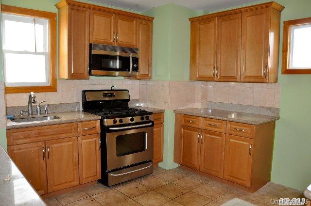 Undisclosed Address Queens, NY 11421 - Photo 3 of 11 KITCHEN