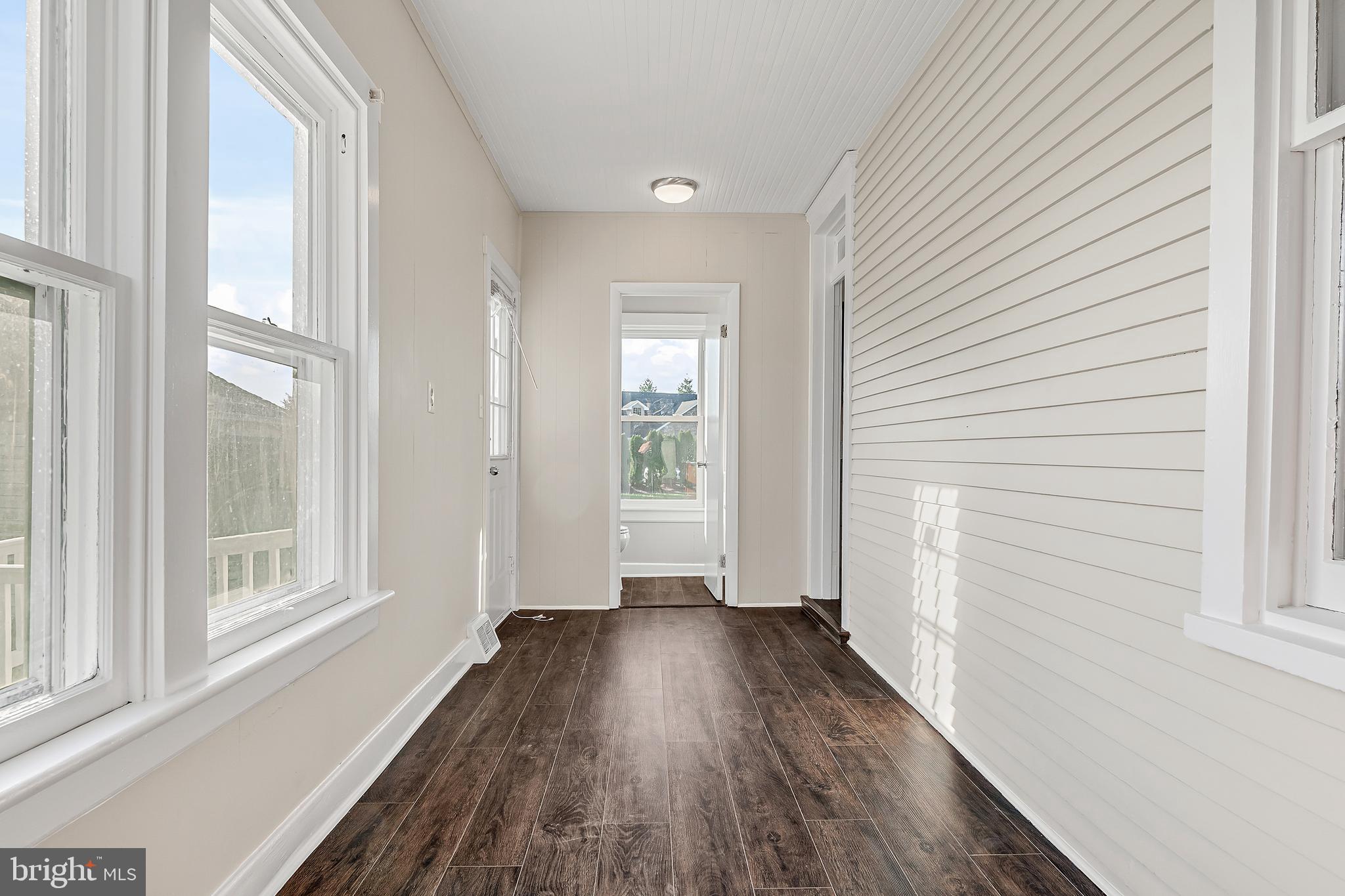 206 Hershey Road Hummelstown, PA 17036 - Photo 13 of 26 a view of a room with wooden floor and windows