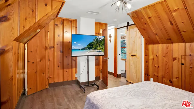 a bed room with a bed and a window