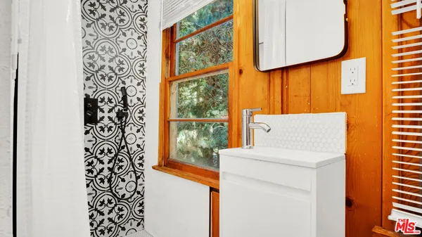 a utility room with a large window dryer and washer