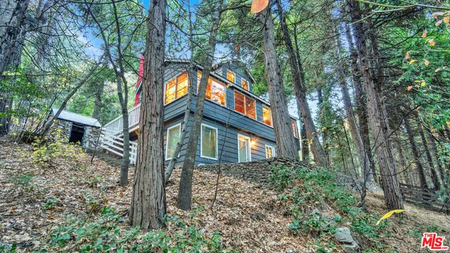 a front view of a house with a yard and balcony