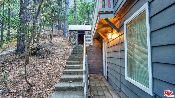 a house with a yard and outdoor seating