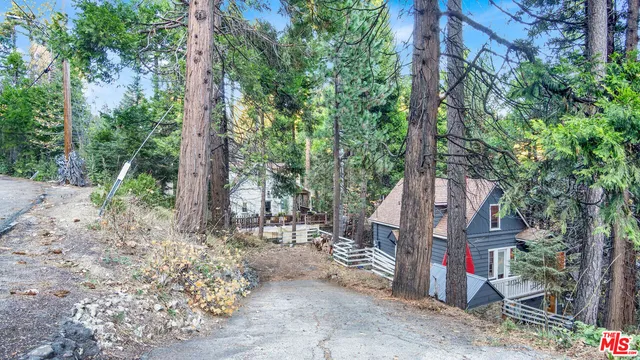 a pathway of a house with a yard
