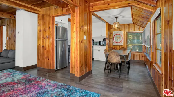 a view of a patio with table and chairs