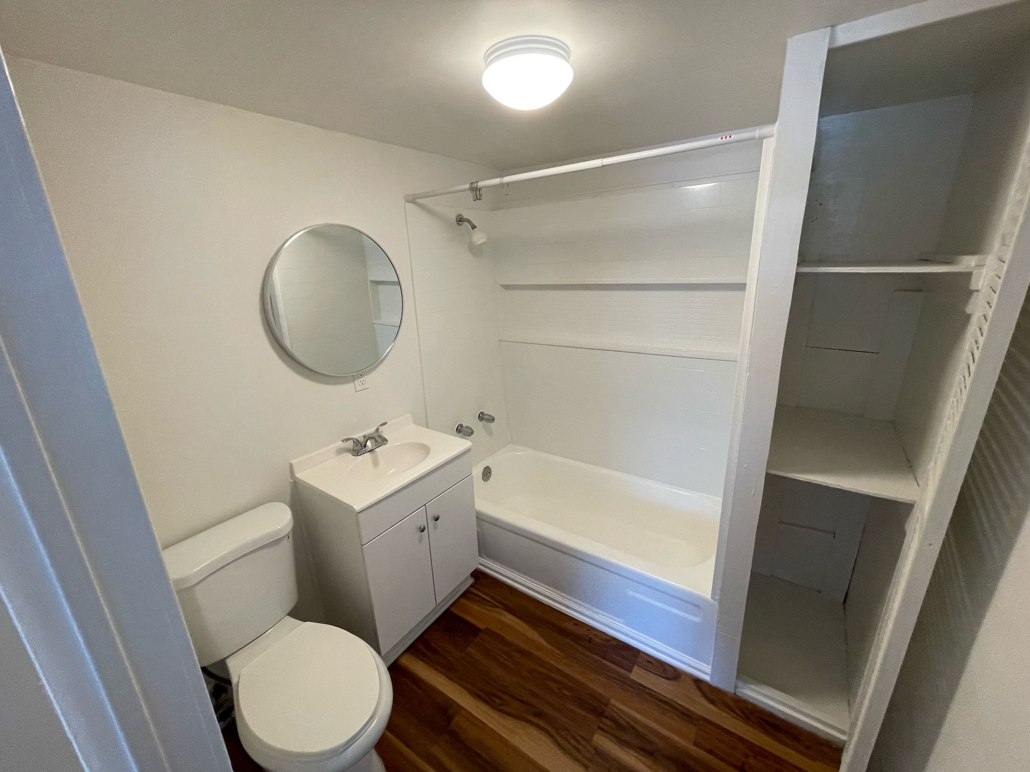 6404 Ponca Street, Unit B Austin, TX 78741 - Photo 12 of 17 a bathroom with a sink a toilet and shower
