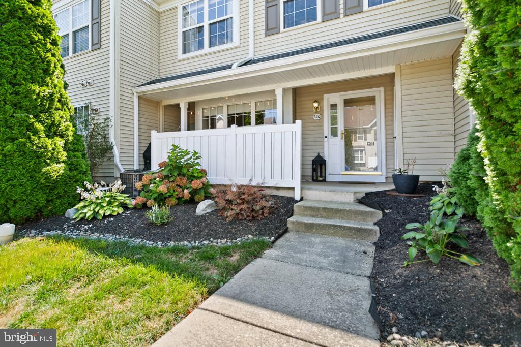 220 Flagstone Road, Unit 6 Chester Springs, PA 19425 - Photo 1 of 32 a front view of a house with garden