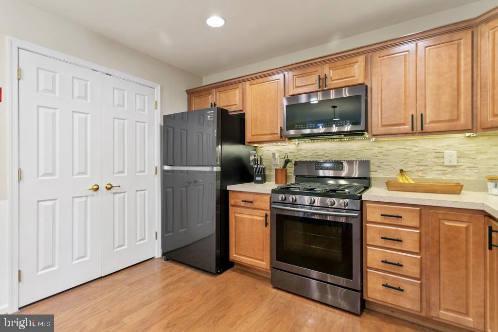 220 Flagstone Road, Unit 6 Chester Springs, PA 19425 - Photo 13 of 32 a kitchen with a stove microwave and refrigerator