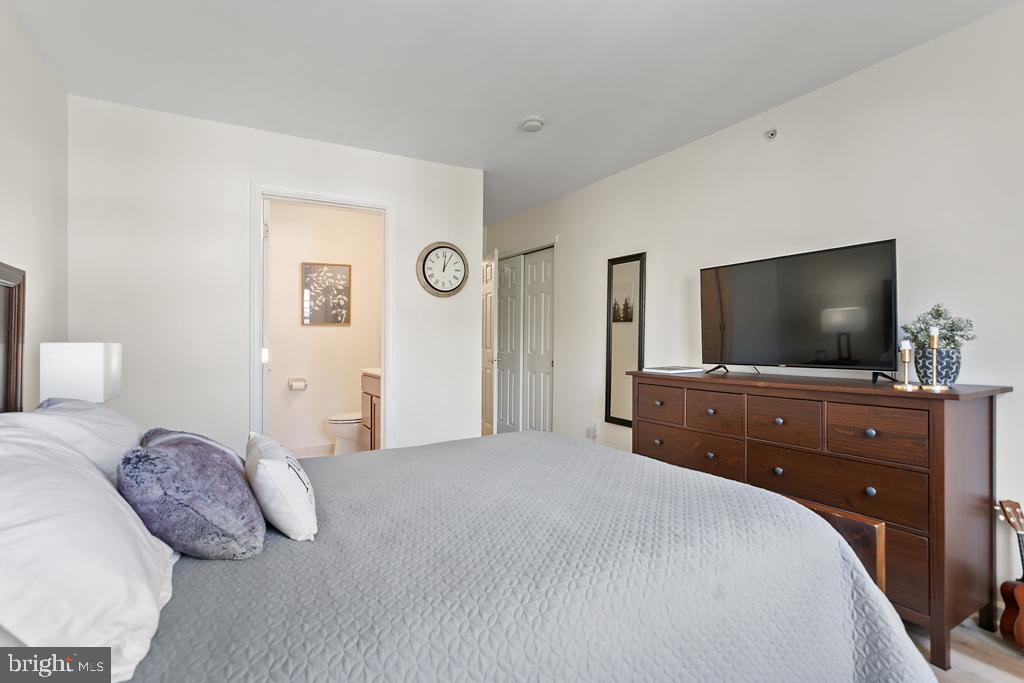 220 Flagstone Road, Unit 6 Chester Springs, PA 19425 - Photo 14 of 32 a bedroom with a bed and a flat screen tv