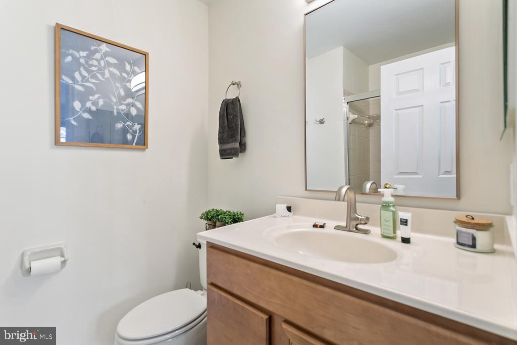 220 Flagstone Road, Unit 6 Chester Springs, PA 19425 - Photo 15 of 32 a bathroom with a sink mirror vanity and toilet
