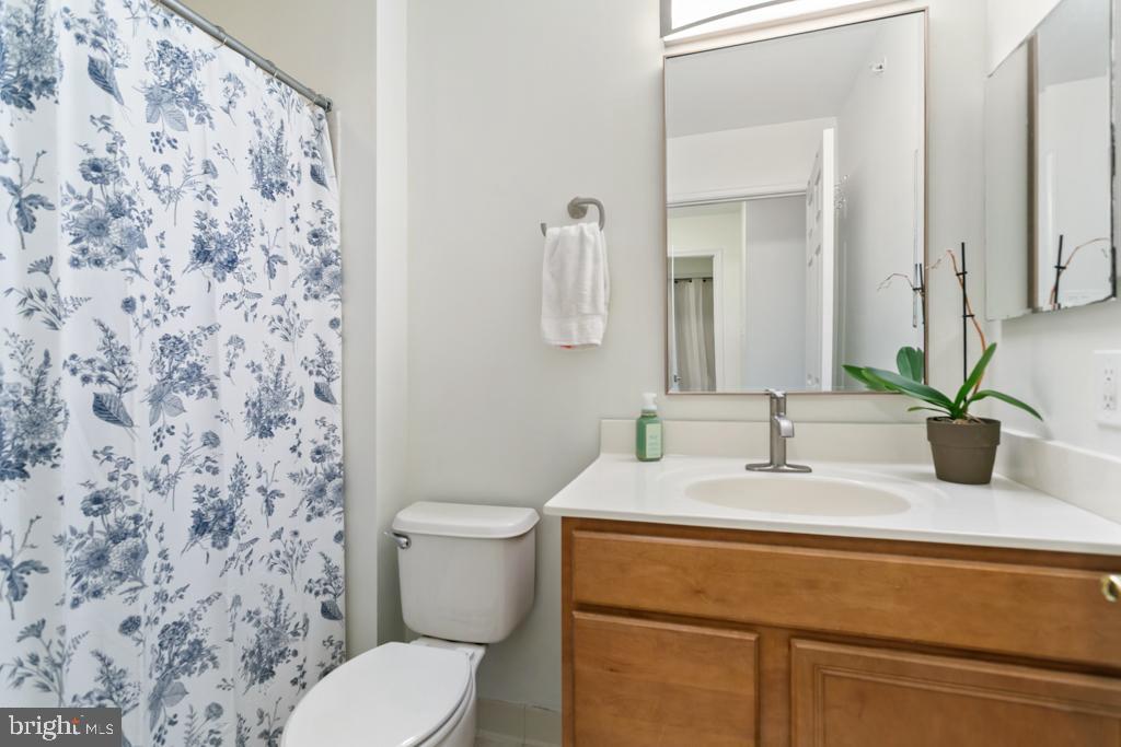 220 Flagstone Road, Unit 6 Chester Springs, PA 19425 - Photo 18 of 32 a bathroom with a toilet sink and mirror