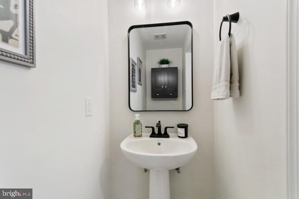 220 Flagstone Road, Unit 6 Chester Springs, PA 19425 - Photo 22 of 32 a bathroom with a sink and a mirror