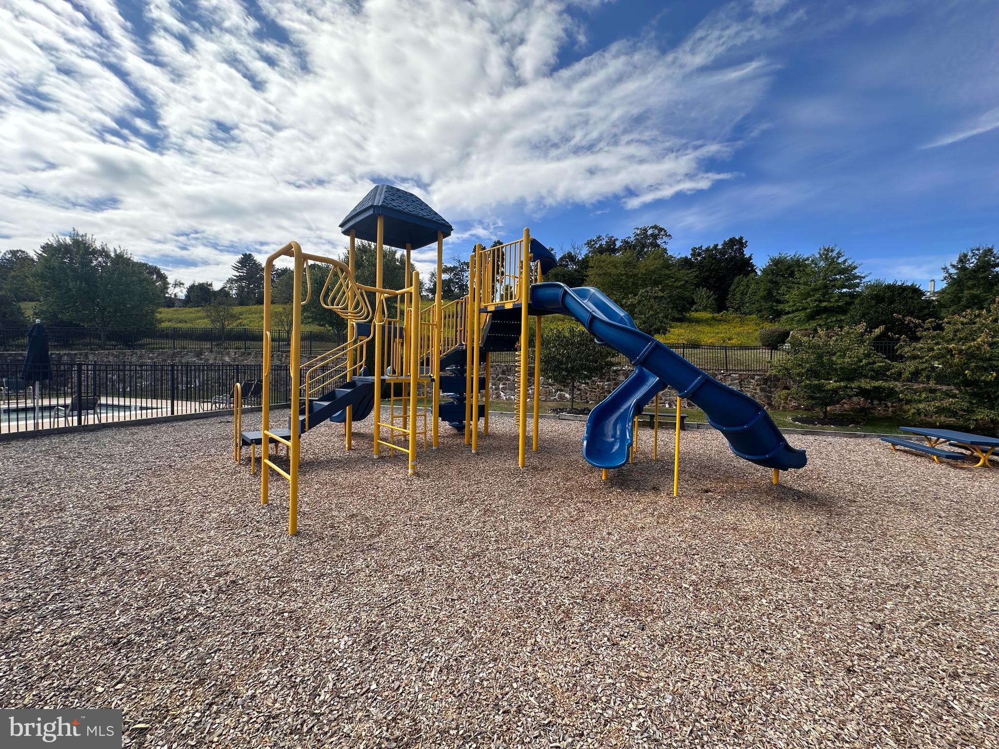 220 Flagstone Road, Unit 6 Chester Springs, PA 19425 - Photo 28 of 32 a view of a park with swings and slides