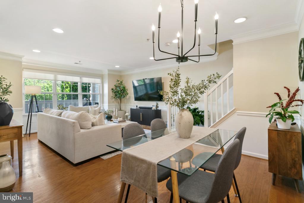 220 Flagstone Road, Unit 6 Chester Springs, PA 19425 - Photo 10 of 32 a living room with furniture a chandelier and a dining room