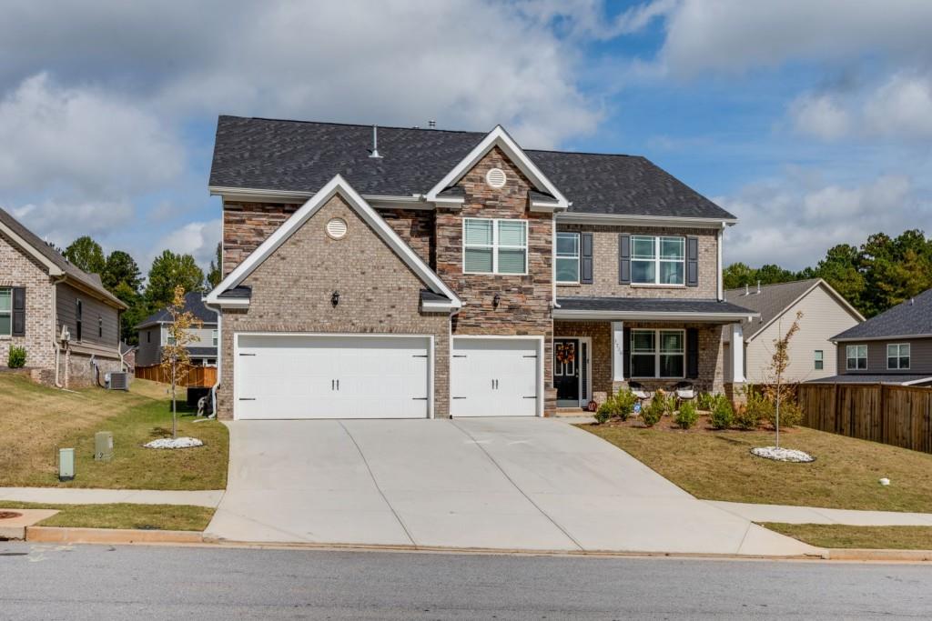 a front view of a house with a yard