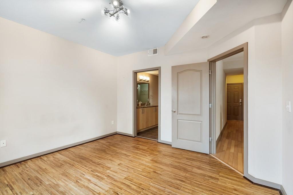 390 17th Street Northwest, Unit 3044 Atlanta, GA 30363 - Photo 12 of 31 a view of an empty room with wooden floor