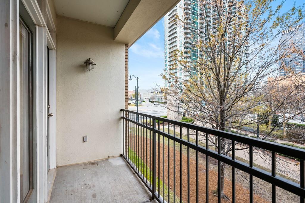 390 17th Street Northwest, Unit 3044 Atlanta, GA 30363 - Photo 17 of 31 a view of a balcony with wooden fence and floor
