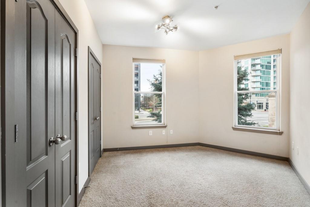 390 17th Street Northwest, Unit 3044 Atlanta, GA 30363 - Photo 19 of 31 a view of an empty room with a window