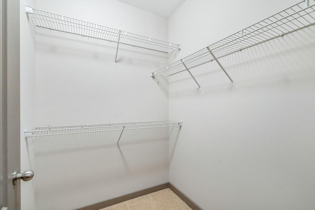 390 17th Street Northwest, Unit 3044 Atlanta, GA 30363 - Photo 23 of 31 a view of a room with racks on the wall