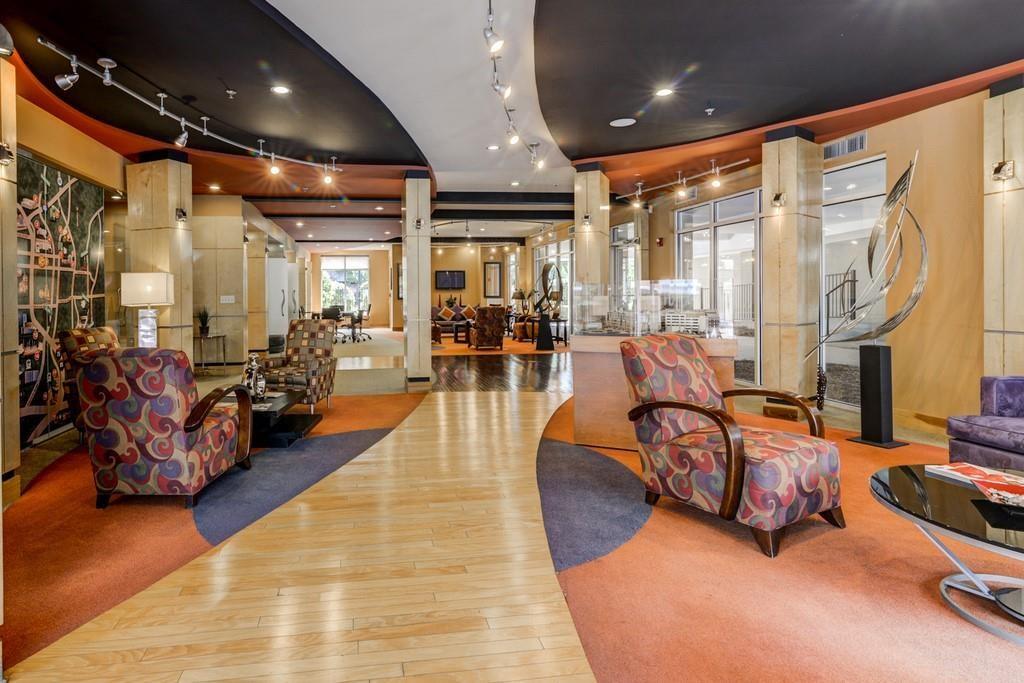 390 17th Street Northwest, Unit 3044 Atlanta, GA 30363 - Photo 29 of 31 a lobby with furniture table and chairs