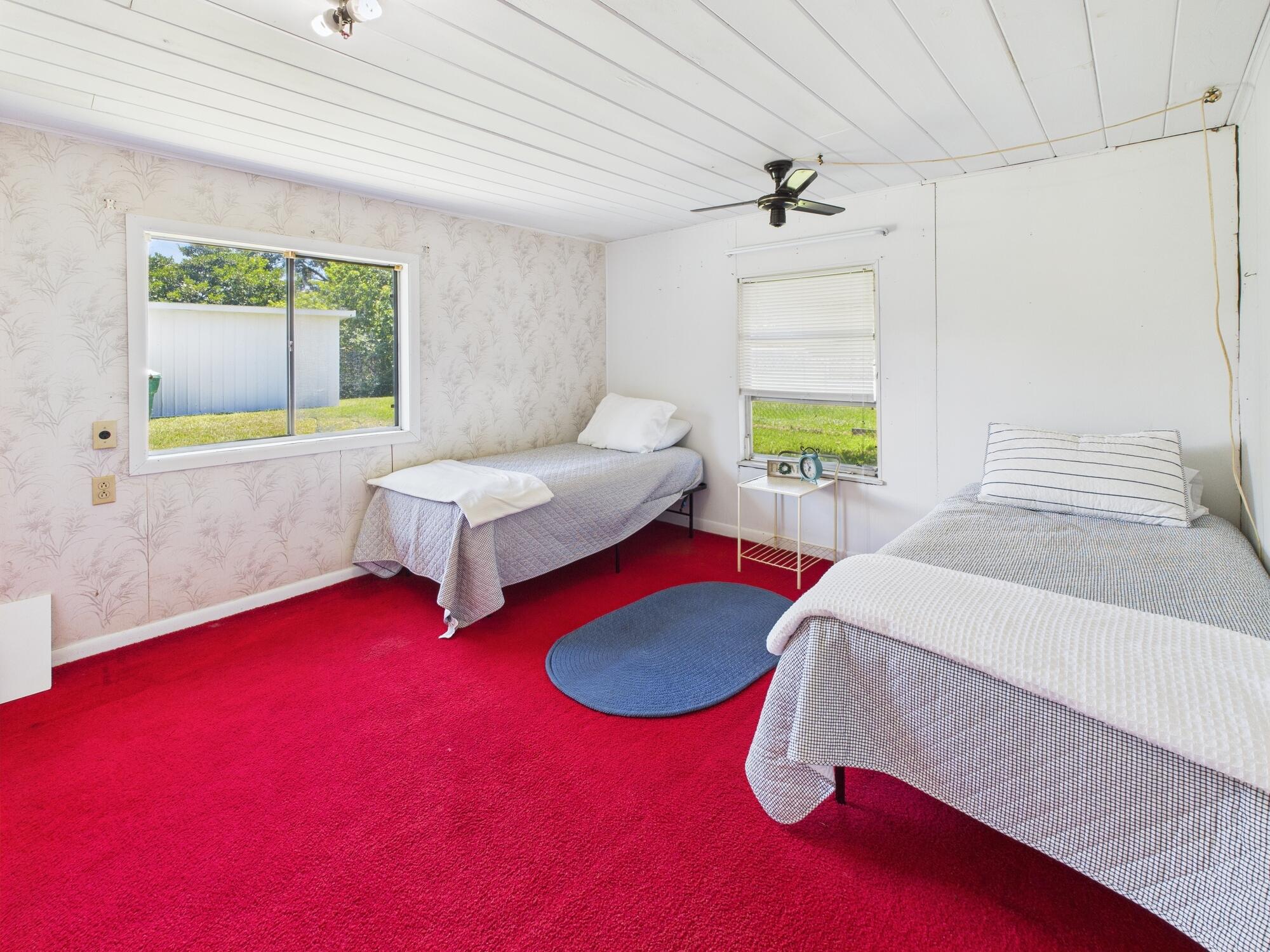 3302 Southeast 34th Avenue Okeechobee, FL 34974 - Photo 17 of 54 a bedroom with furniture and a large window