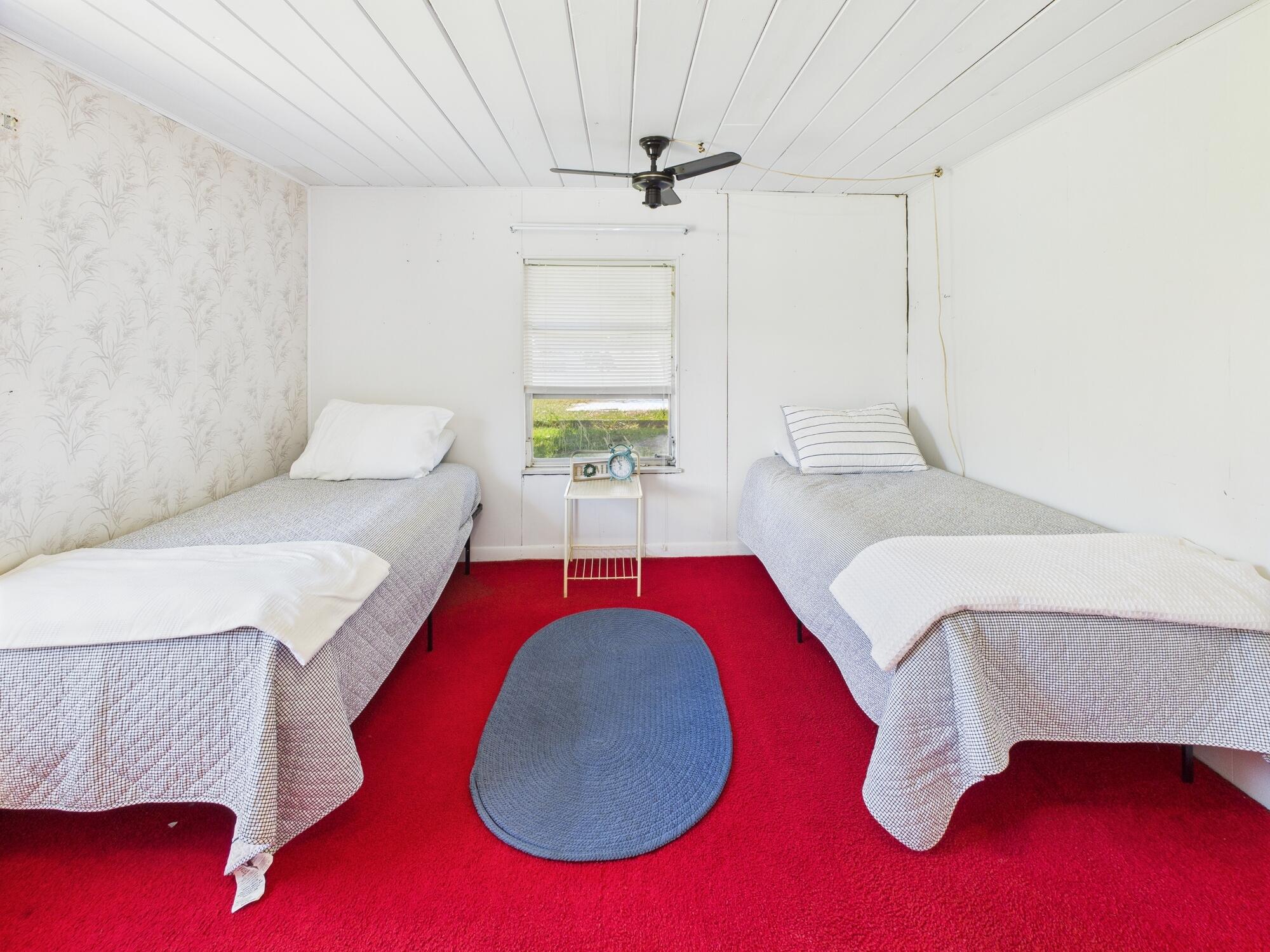 3302 Southeast 34th Avenue Okeechobee, FL 34974 - Photo 18 of 54 a living room with furniture and a rug