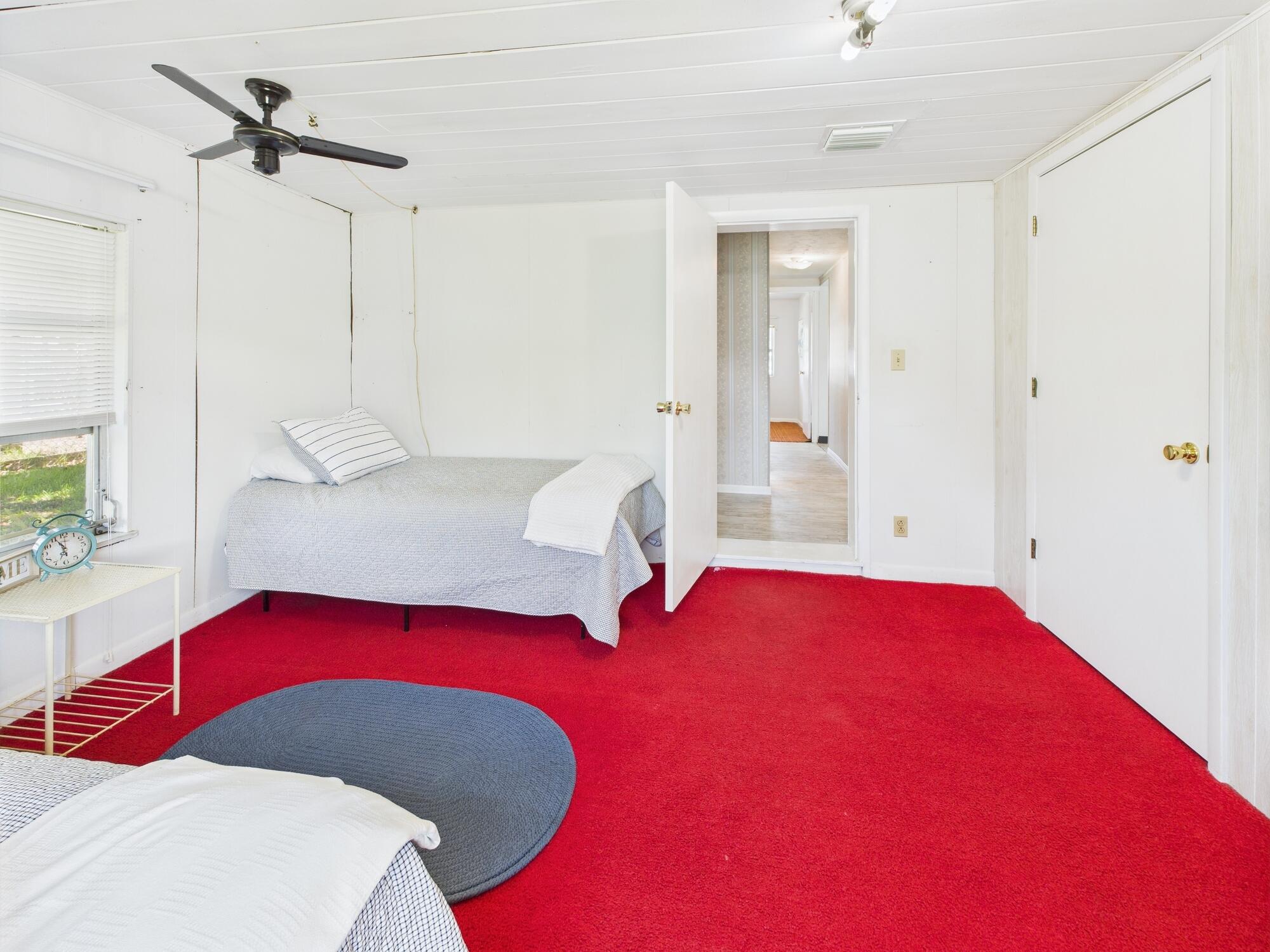 3302 Southeast 34th Avenue Okeechobee, FL 34974 - Photo 20 of 54 a bedroom with a bed and a chandelier