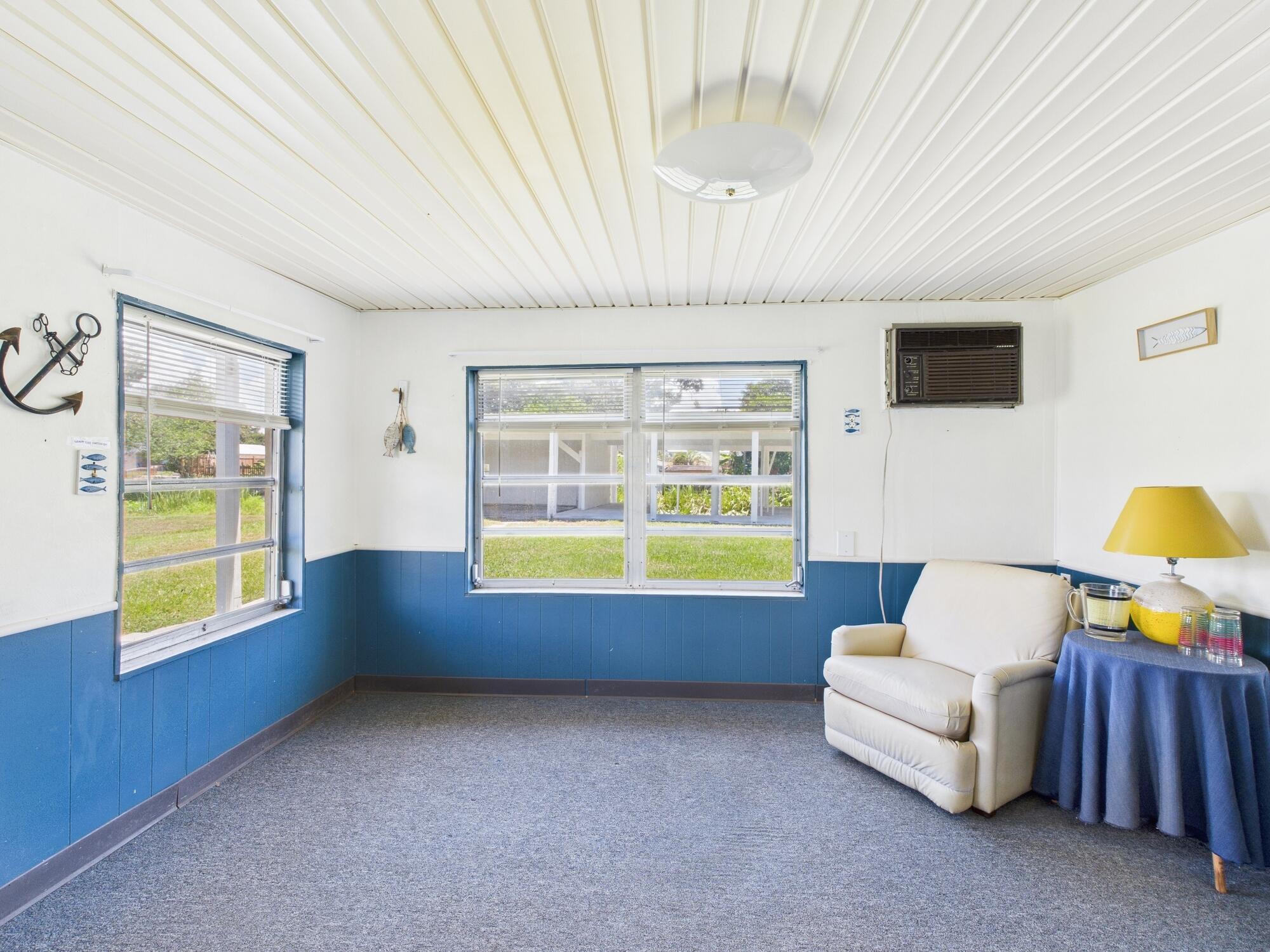 3302 Southeast 34th Avenue Okeechobee, FL 34974 - Photo 28 of 54 a living room with furniture and a large window