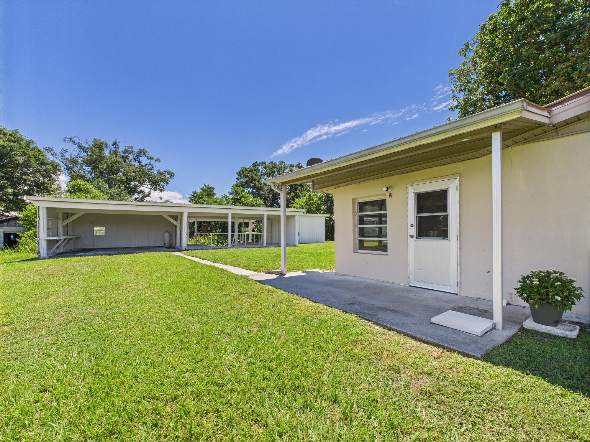 3302 Southeast 34th Avenue Okeechobee, FL 34974 - Photo 32 of 54 a view of outdoor space yard and swimming pool