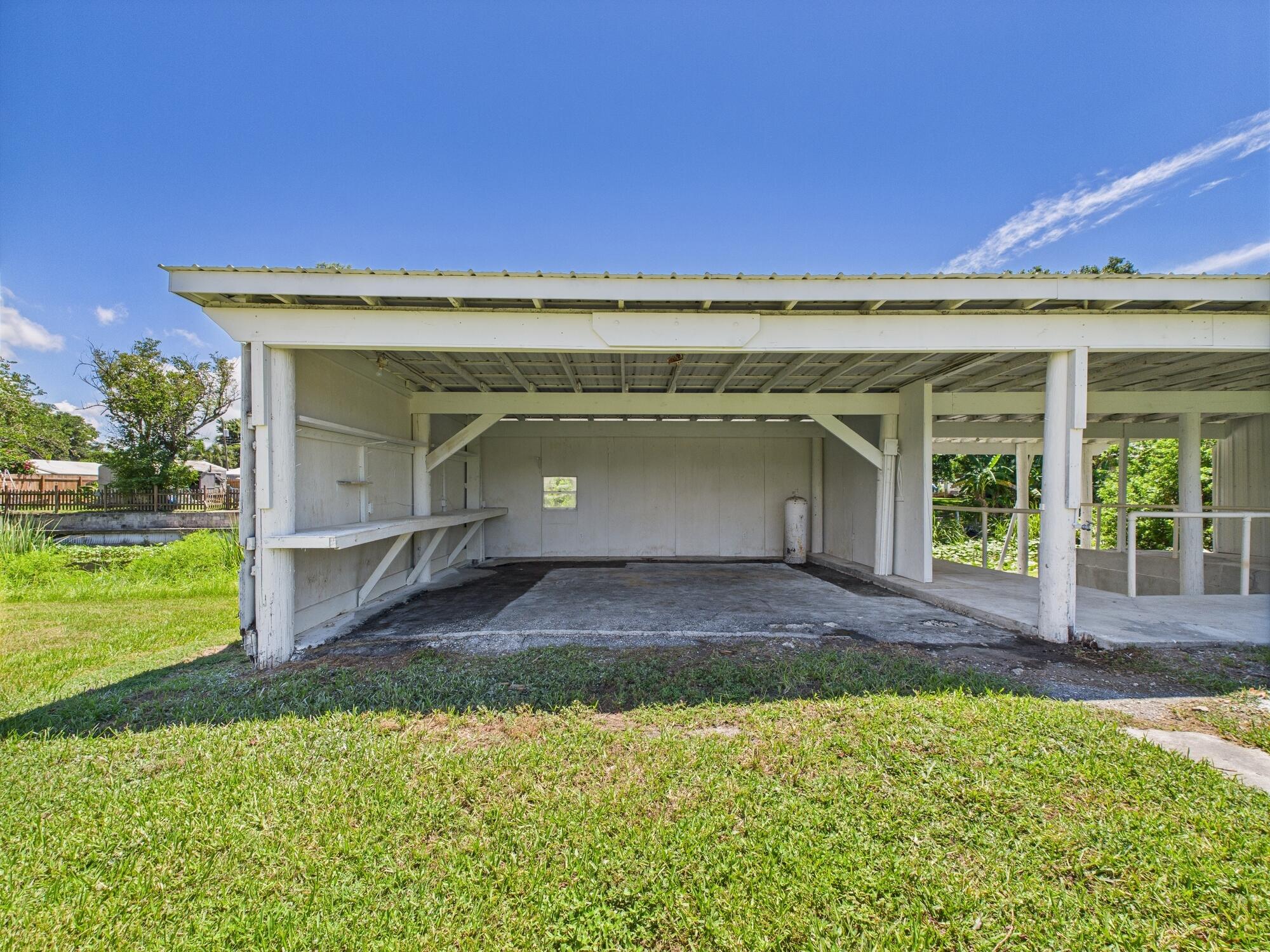 3302 Southeast 34th Avenue Okeechobee, FL 34974 - Photo 36 of 54 a view of a house with a outdoor space