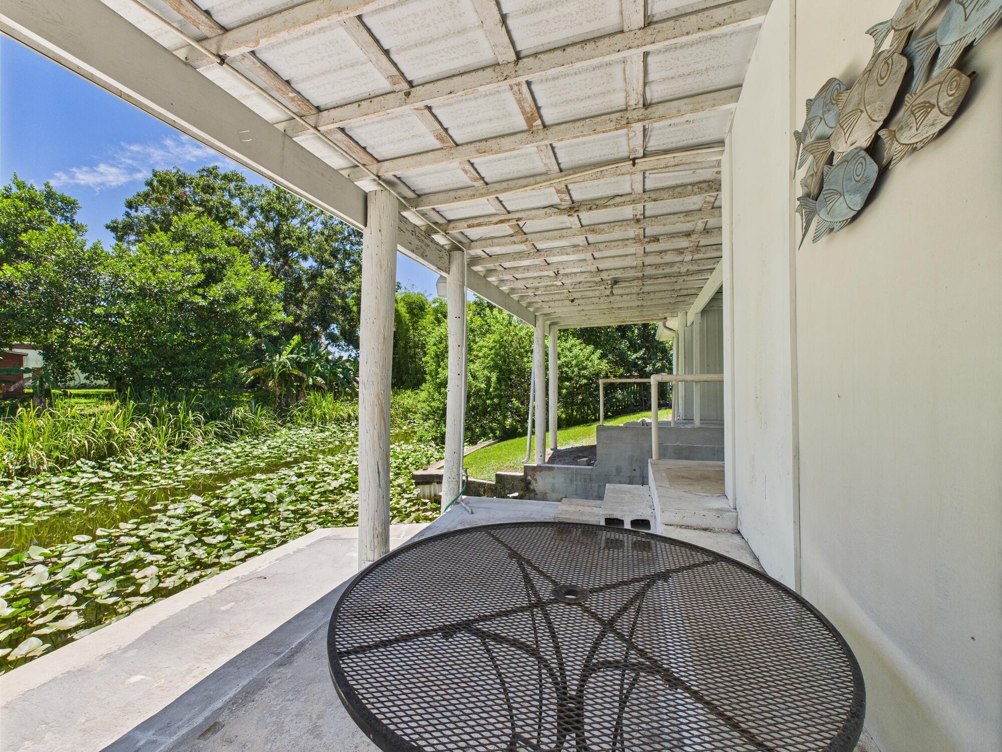 3302 Southeast 34th Avenue Okeechobee, FL 34974 - Photo 48 of 54 a room with pool table and windows