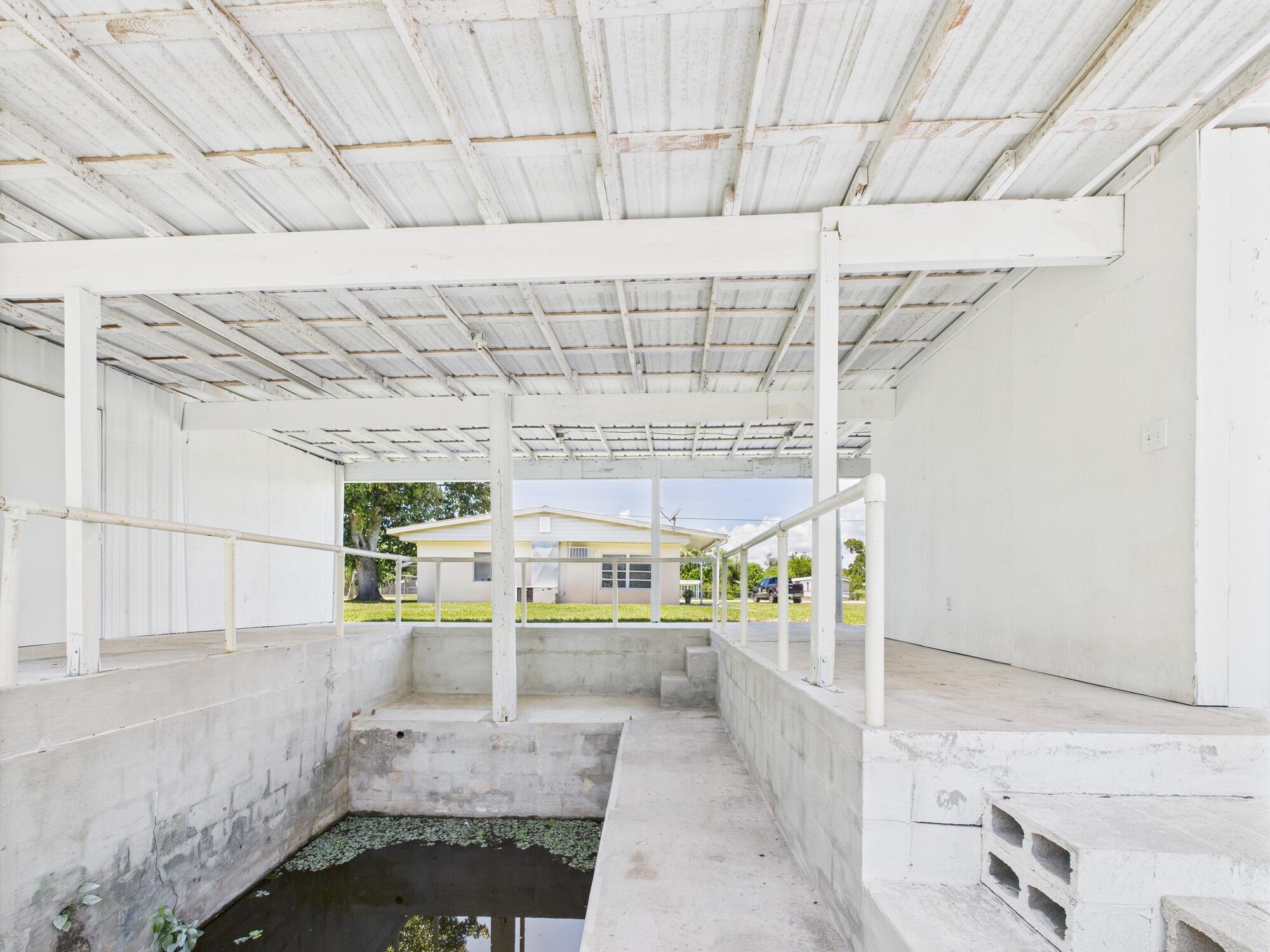 3302 Southeast 34th Avenue Okeechobee, FL 34974 - Photo 49 of 54 a view of a room with racks