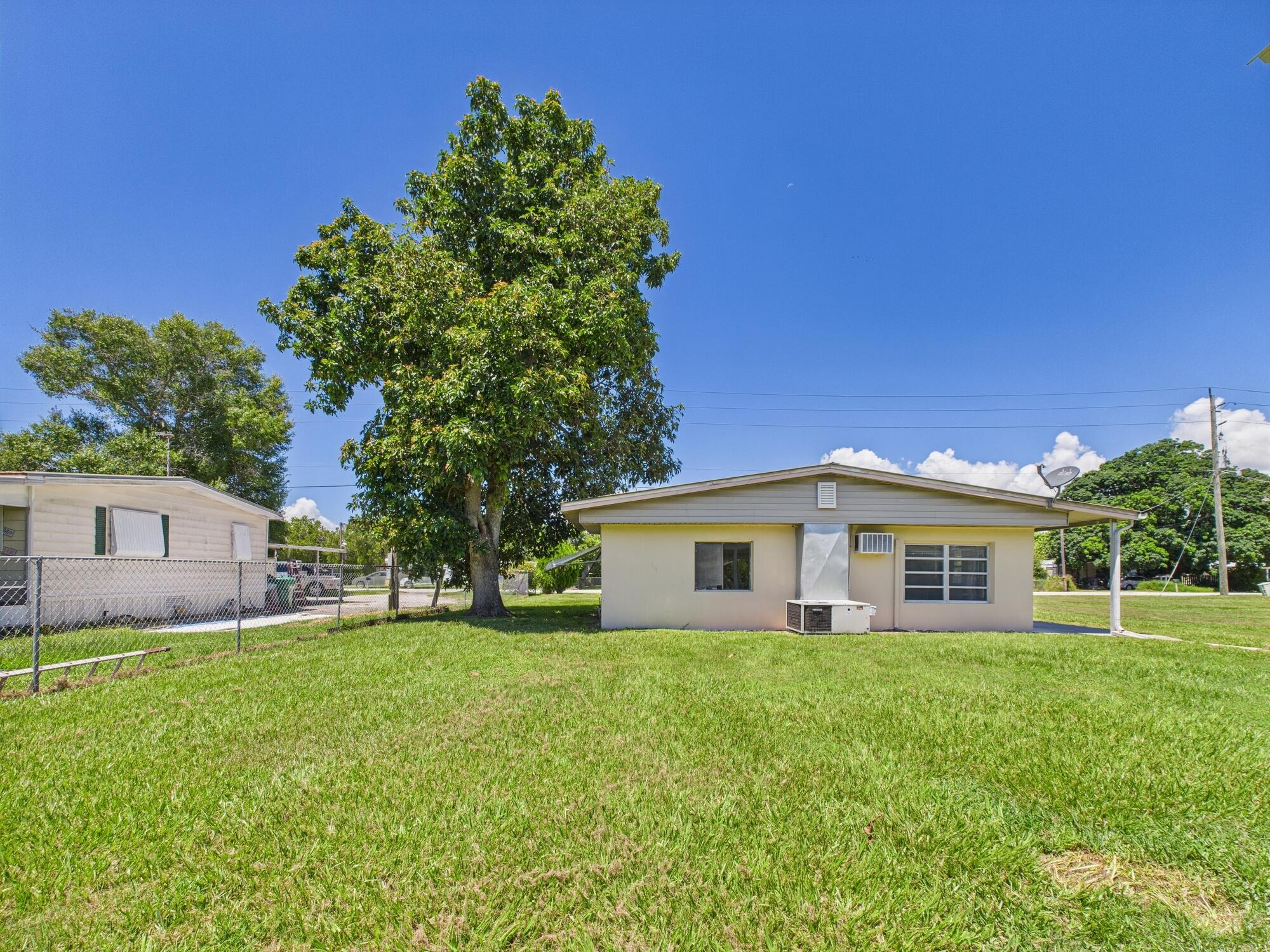 3302 Southeast 34th Avenue Okeechobee, FL 34974 - Photo 53 of 54 a view of a house with a yard