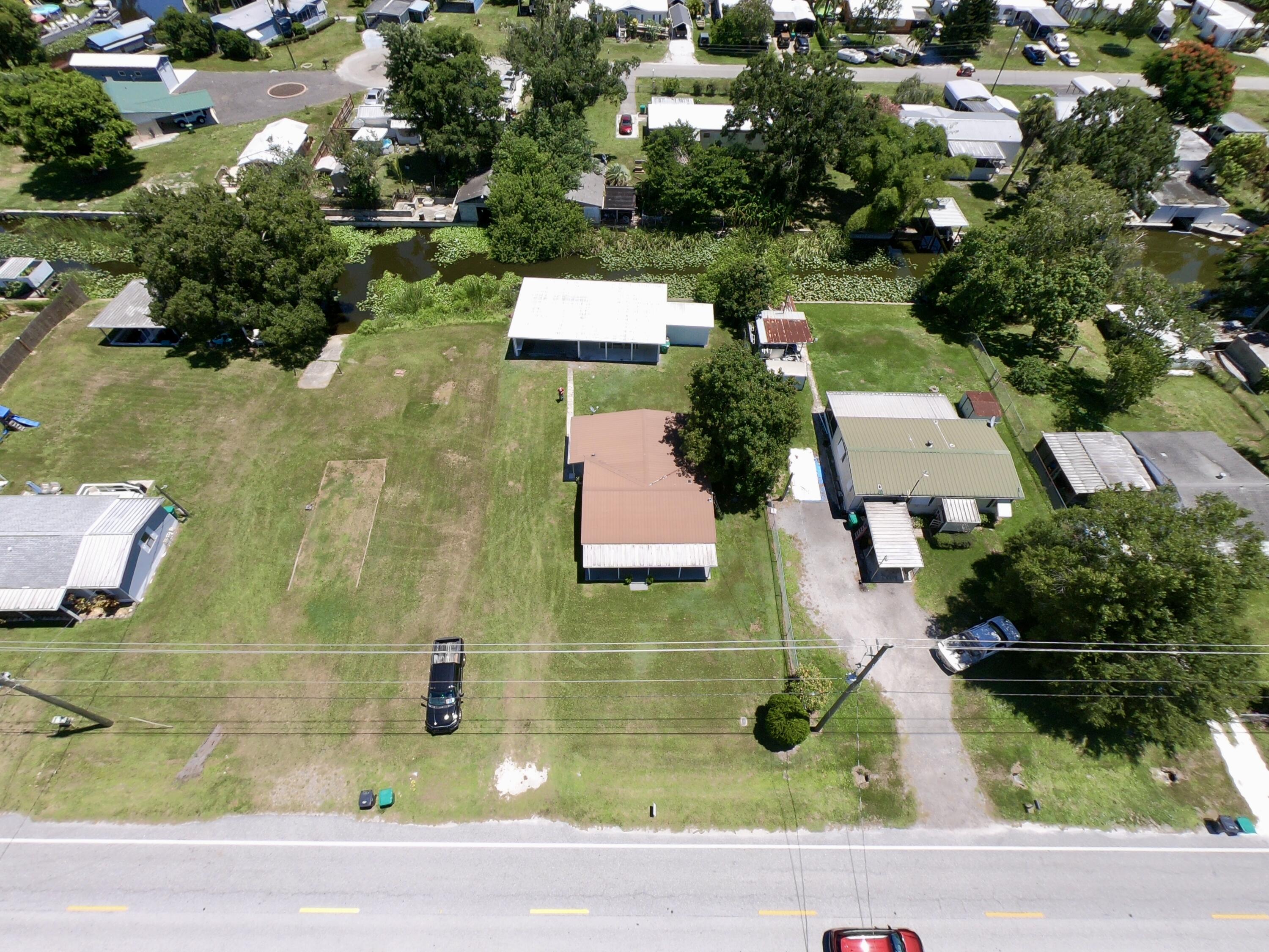 3302 Southeast 34th Avenue Okeechobee, FL 34974 - Photo 54 of 54 an aerial view of residential houses with yard