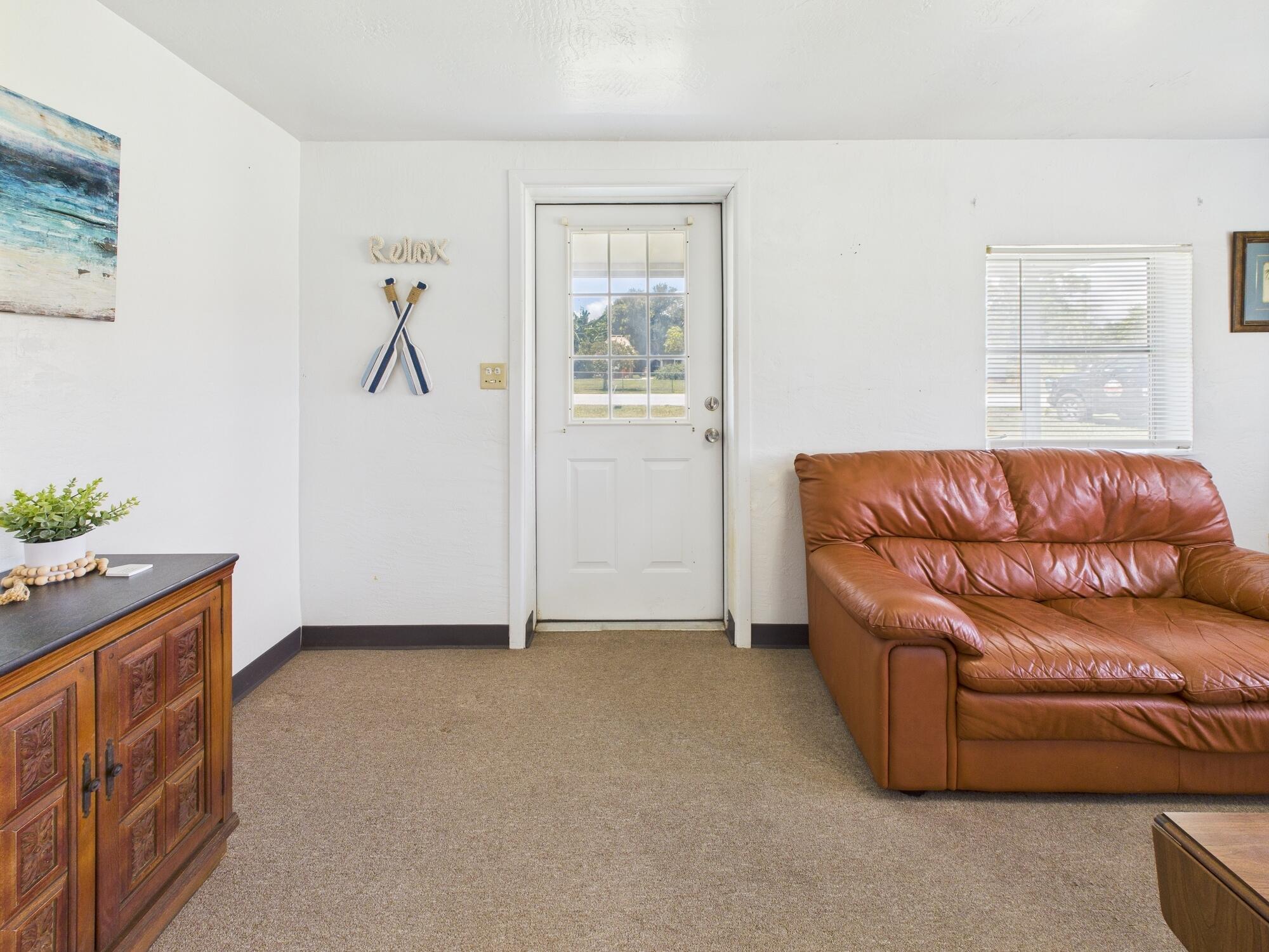3302 Southeast 34th Avenue Okeechobee, FL 34974 - Photo 6 of 54 a living room with furniture and a window