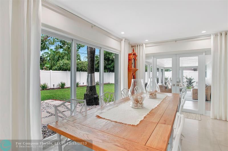 1985 Sailfish Place Pompano Beach, FL 33062 - Photo 12 of 47 a living room with a floor to ceiling window and wooden floor