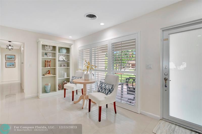 1985 Sailfish Place Pompano Beach, FL 33062 - Photo 27 of 47 a living room with furniture and large windows