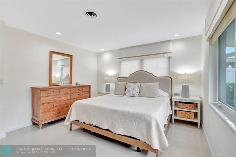 1985 Sailfish Place Pompano Beach, FL 33062 - Photo 28 of 47 a bedroom with a bed and a night stand